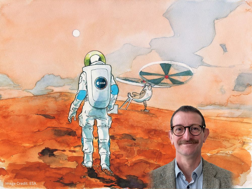 Dr. Albert Haldemann in front of an ESA graphic of martian surface