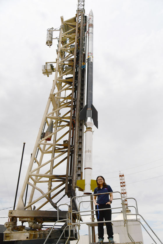 Chi nguyen in front of the Black Brant IX sounding rocket.