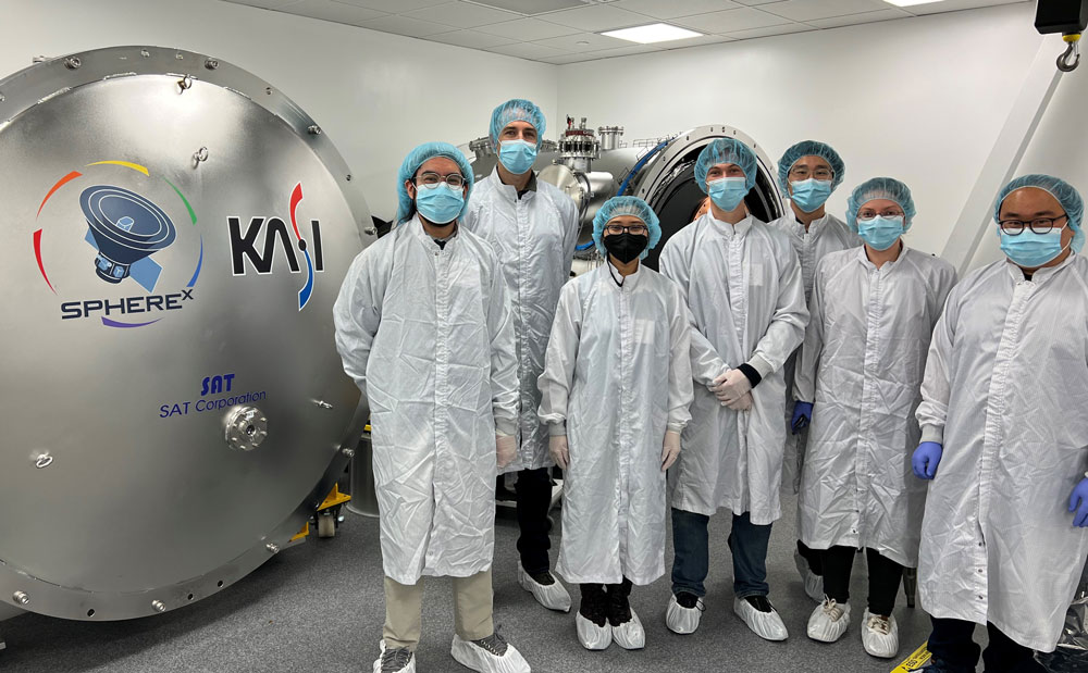KISS Affiliates in clean room standing in front of SPHEREx