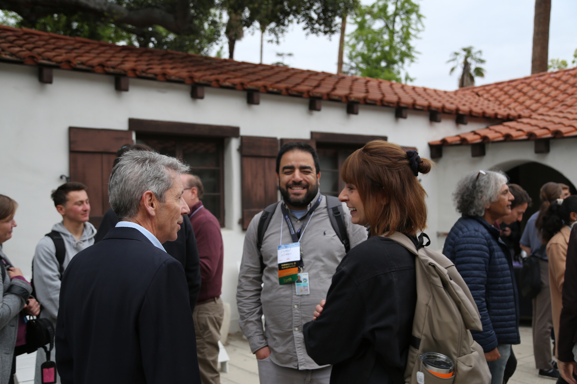 Three individuals engaged in discussion