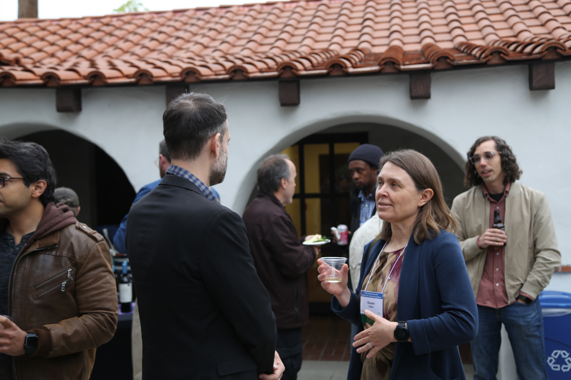 two individuals convivially discussing