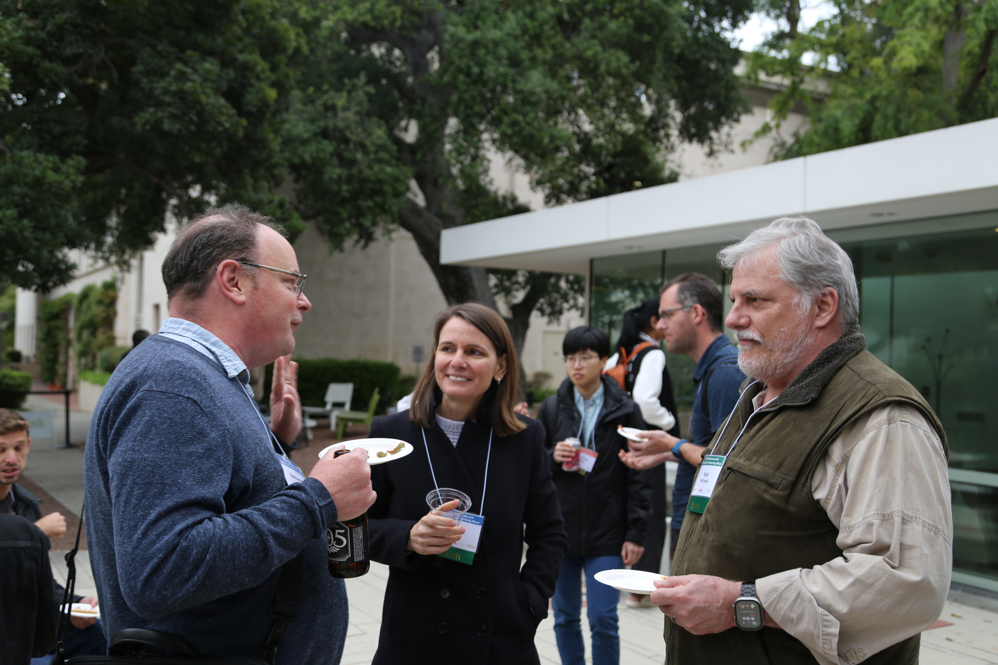 Three individuals engaged in discussion