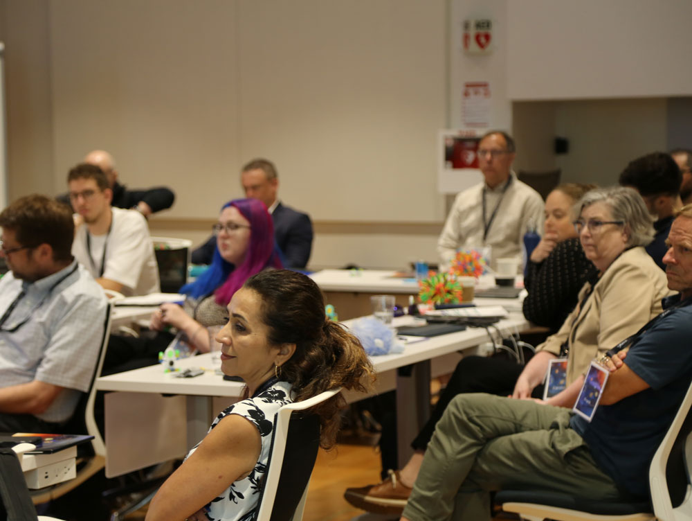 seated participants in conference room