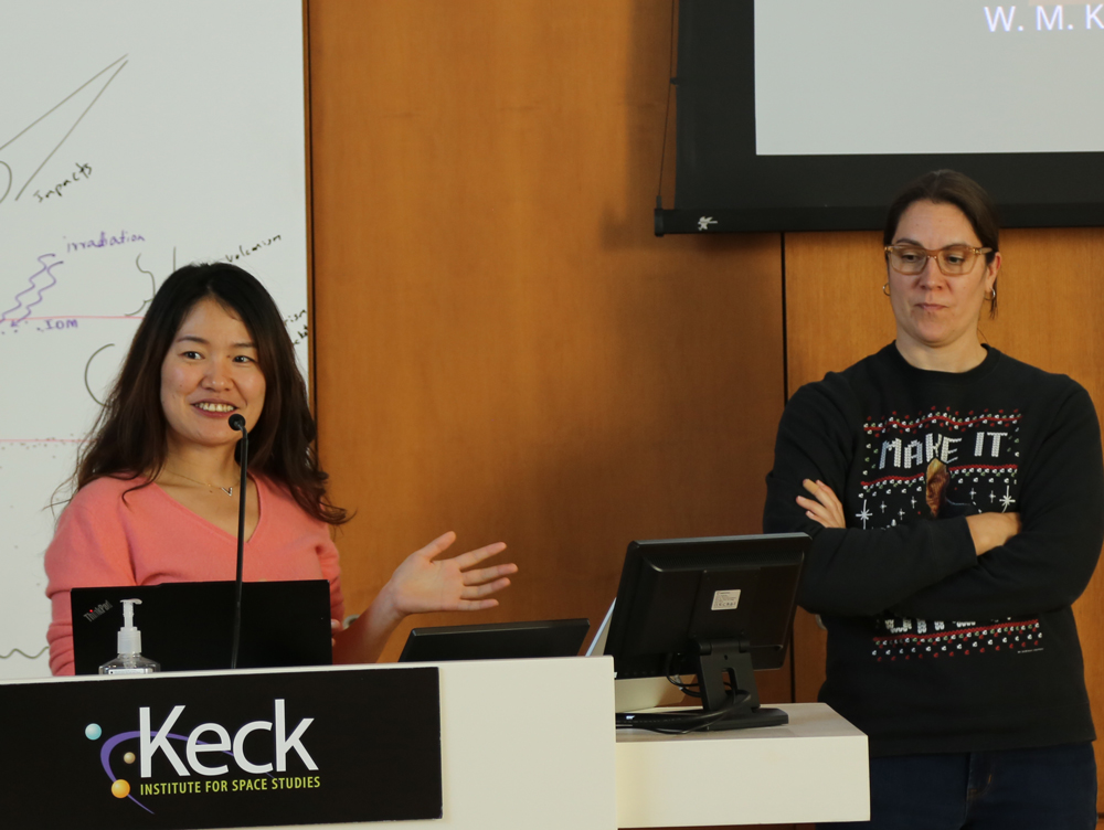 two people presenting at podium