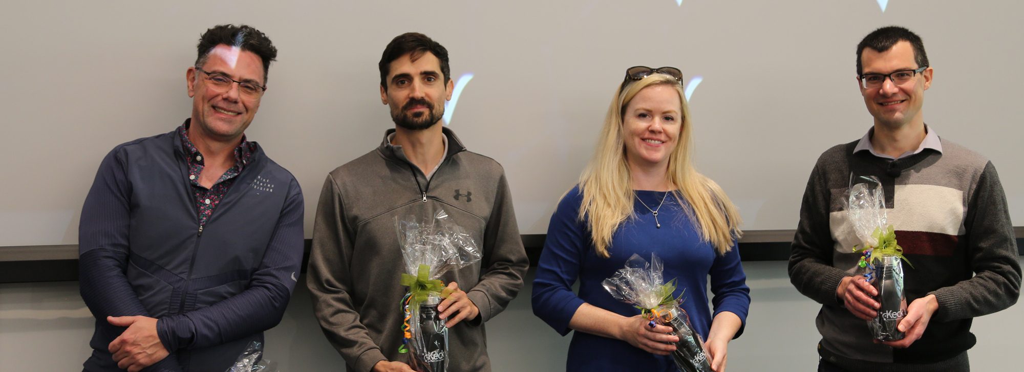 four presenters for short course holding thank you gift